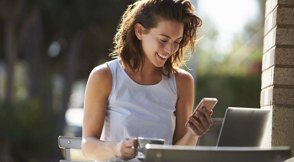 Woman reading egg donation FAQ